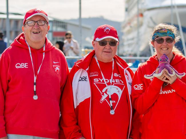 Sydney swans fans Garyth Christensen, Darrell Foxley and Katie Lofthouse who travelled to Hobart on board the first ever Sydney Swans member cruise.Picture: Linda Higginson