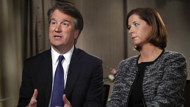 Brett Kavanaugh, with his wife Ashley Estes Kavanaugh, answers questions during a FOX News interview. Picture: AP