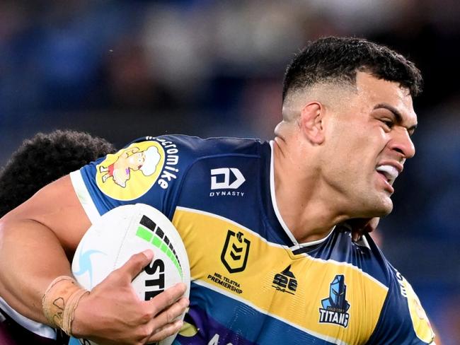 GOLD COAST, AUSTRALIA - AUGUST 14: David Fifita of the Titans attempts to break free from the defence during the round 22 NRL match between the Gold Coast Titans and the Manly Sea Eagles at Cbus Super Stadium, on August 14, 2022, in Gold Coast, Australia. (Photo by Bradley Kanaris/Getty Images)