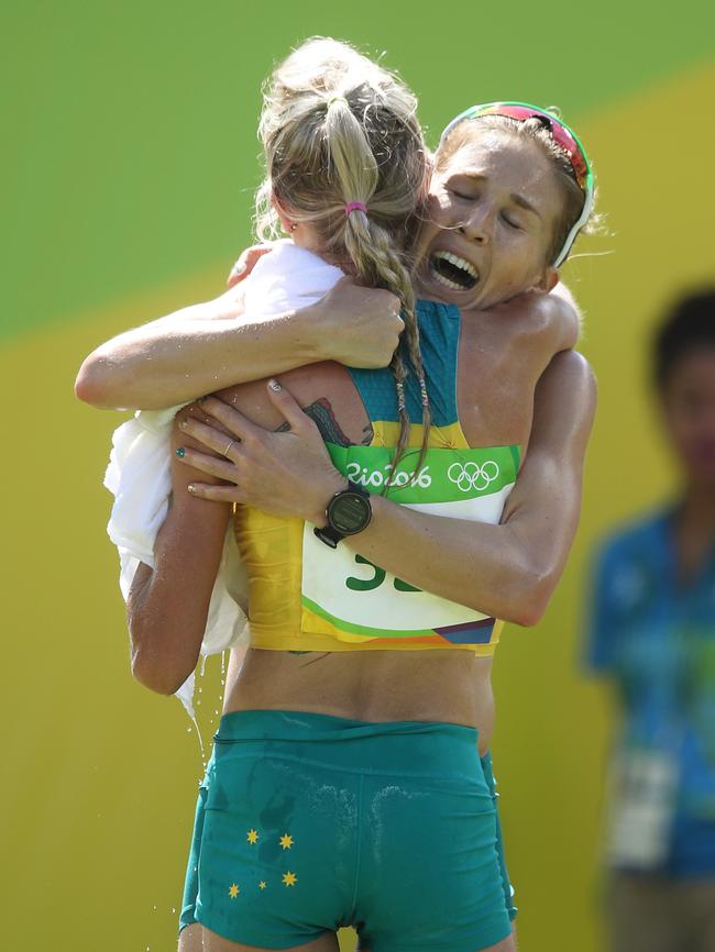 Trengove and Australian teammate Milly Clark embrace after the marathon at the Rio Olympics. Picture: Brett Costello