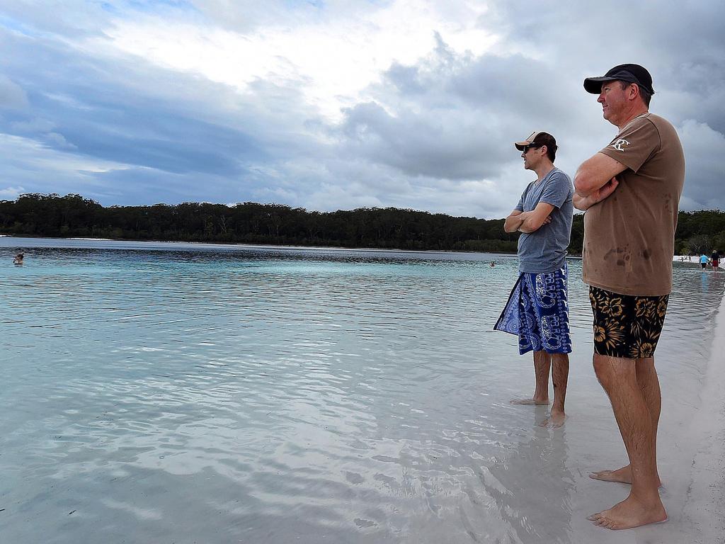 Tourists Anthony Stave and Andrew Foreman at Lake McKenzie after the bodies of two boys were found.