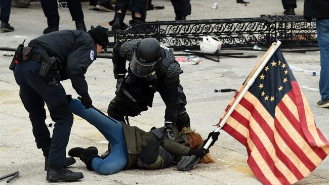 Police detain a Trump supporter outside the US Capitol in Washington, DC. Picture: Roberto Schmidt/AFP