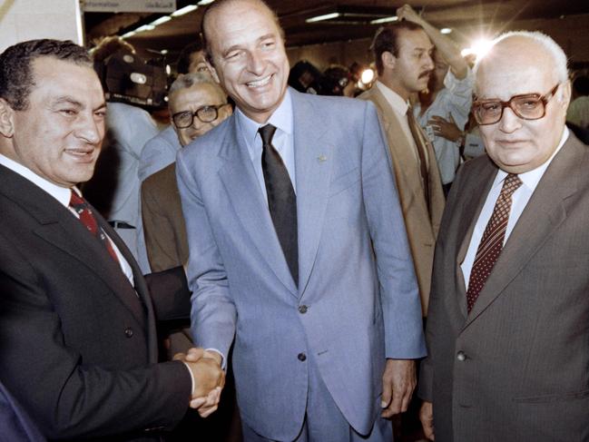 A file photo taken on September 27, 1987 shows French prime minister Jacques Chirac (C) shaking hands with Egyptian president Hosni Mubarak (L), along with Egyptian Prime minister Atef Sedki (R) at the official opening of the Cairo underground. Picture: AFP