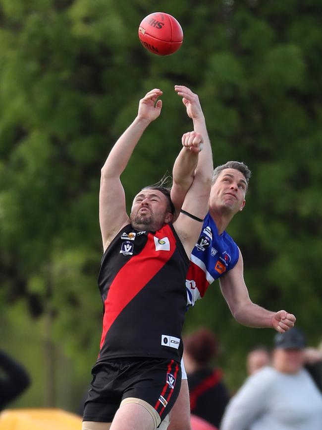 Waaia’s Dylan Moncur and Strathmerton’s Lewis O'Sullivan compete in the air.