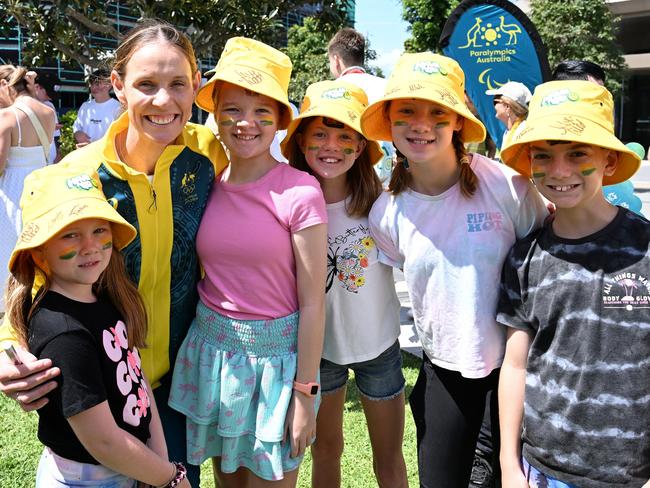 Alyce Wood poses for a photo with the fans - and daughter Florence at far left - during a Welcome Home Event for Australia's Olympians and Paralympians. Picture: Getty Images