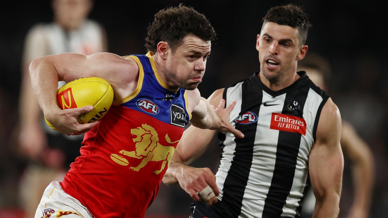 MELBOURNE, AUSTRALIA - August 18, 2023. AFL . Lachie Neale of the Lions fends off Scott Pendlebury of the Magpies during the round 23 match between Collingwood and the Brisbane Lions at Marvel Stadium in Melbourne, Australia. Photo by Michael Klein.