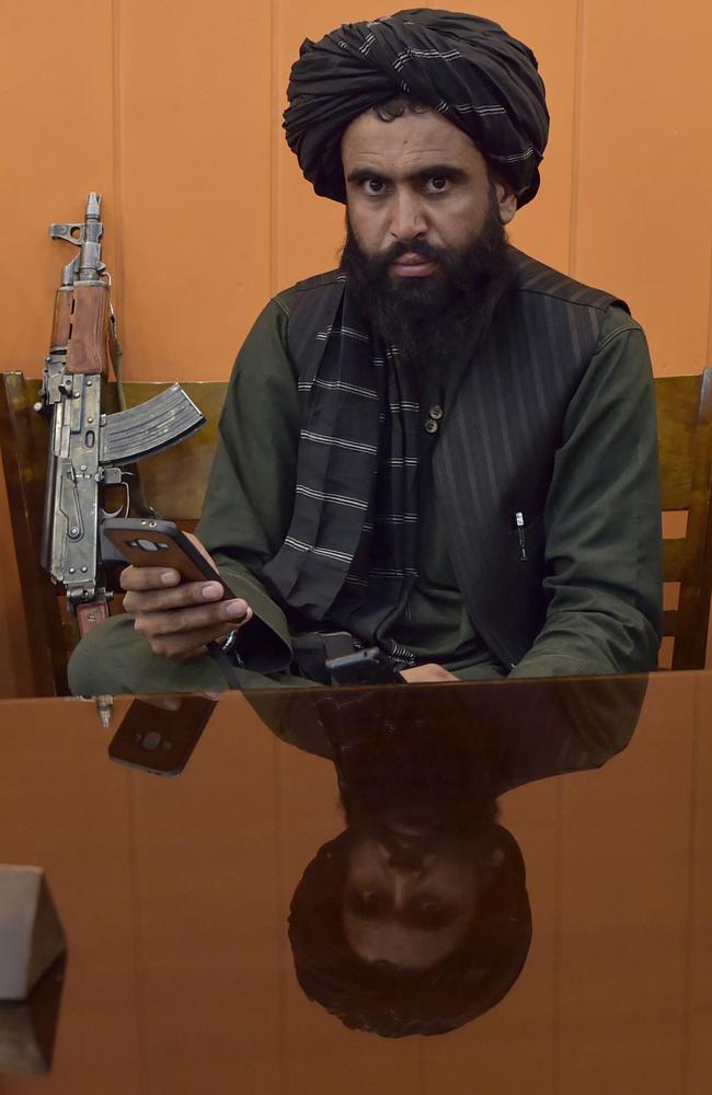 A Taliban fighter pictured at a restaurant in Kabul as the terrorist organisation set off two suicide bombings at the airport. Picture: AFP