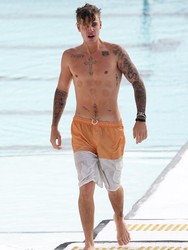 Justin Bieber spotted swimming at Bondi Iceberg in Sydney. Picture: KHAPGG/Matrix
