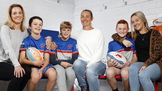 Junior Engadine rugby league players and their mums (from left) Nicole White with son Lucas, 11, Claire Cousemacker with son Lucas, 12, and Beck Kiellor with son Coby, 12, at the Dragons’ clubhouse. Picture: Jonathan Ng