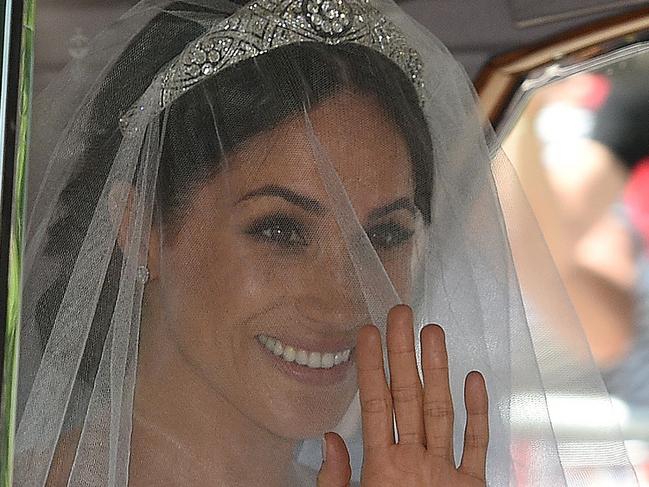 Meghan Markle arrives for her wedding ceremony to marry Britain's Prince Harry, Duke of Sussex, at St George's Chapel, Windsor Castle, in Windsor, on May 19, 2018. / AFP PHOTO / Oli SCARFF