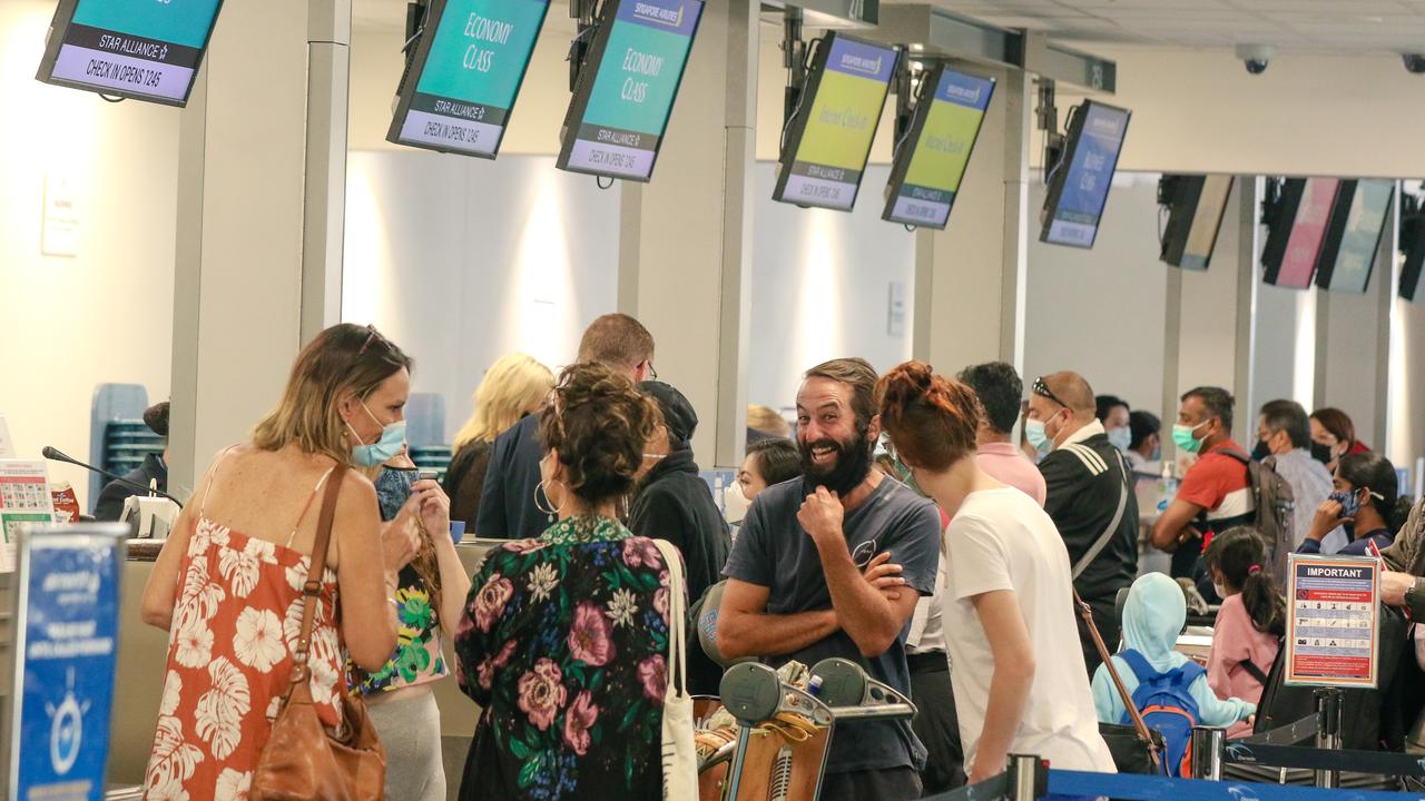 A packed check in counter as the First SIngapore Airlines regular service lands in Darwin today. Picture: Glenn Campbell