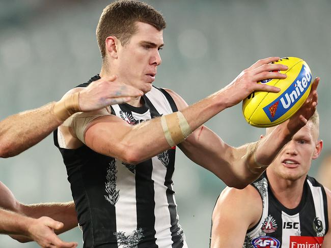 AFL Round 5. Collingwood v Essendon at the MCG. 03/07/2020.  Mason Cox of the Magpies takes possession infant of Andrew Phillips of the Bombers    . Pic: Michael Klein