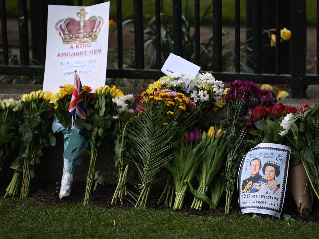 Messages amid floral tributes near Windsor Castle in Windsor, west of London following the April 9 death of Britain's Prince Philip, Duke of Edinburgh. Picture: AFP