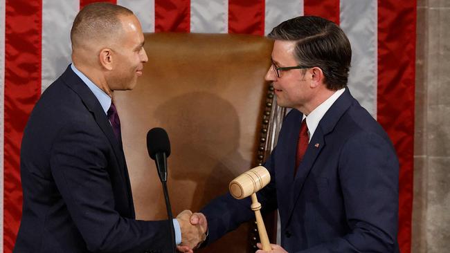 Democrat and. House Minority Leader Hakeem Jeffries passes the gavel to Speaker of the House Mike Johnson on the first day of the 119th Congress in the House Chamber of the US Capitol Building on January 03, 2025 in Washington, DC. (Photo by CHIP SOMODEVILLA / GETTY IMAGES NORTH AMERICA / Getty Images via AFP)