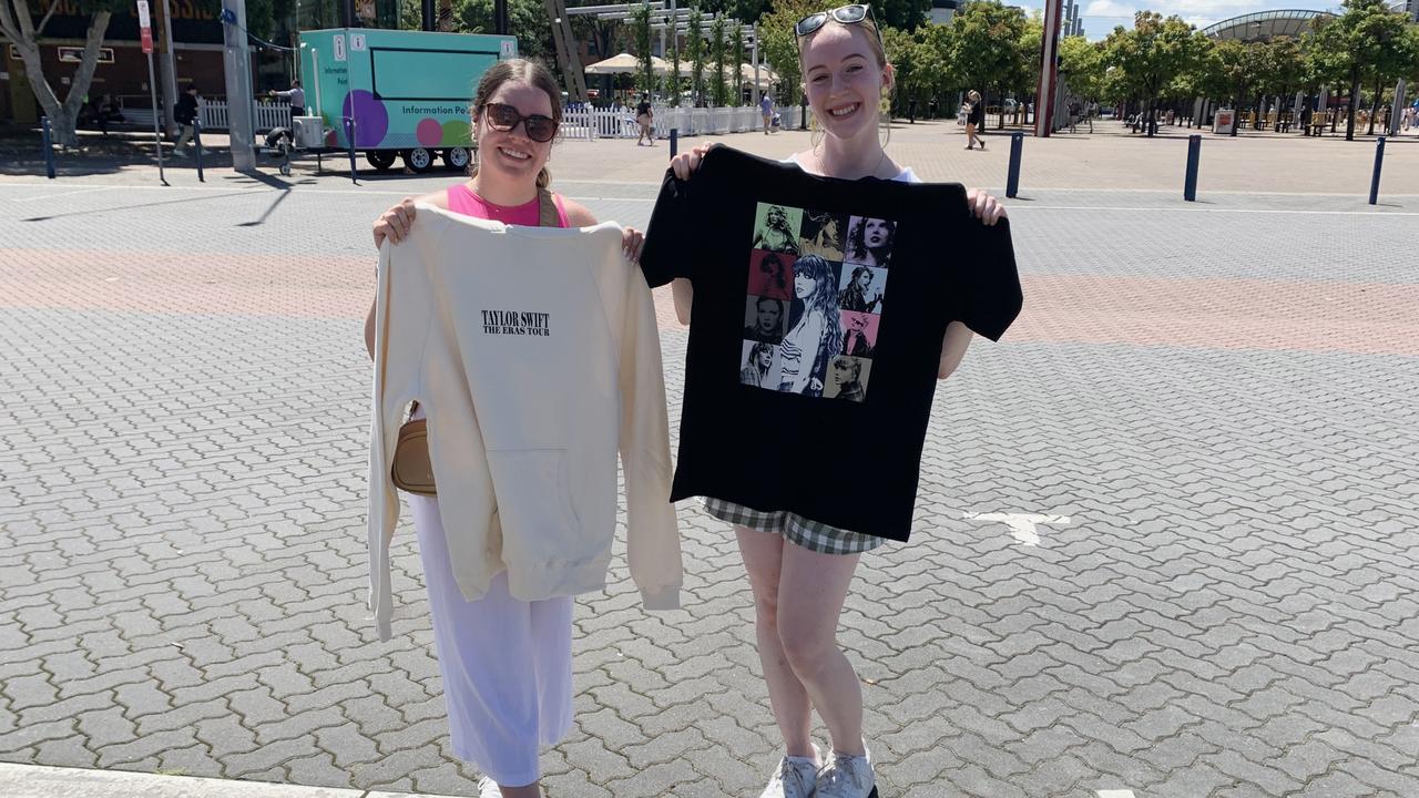 Hannah (L) and Matia spent just under $1000 on merchandise for themselves, friends and family outside Accor Stadium on Thursday. Picture: Clareese Packer.