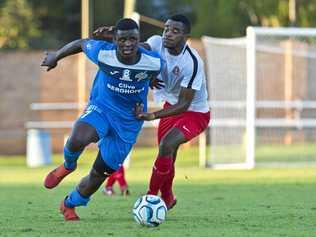 MIDFIELD MAESTRO: South West Queensland Thunder midfielder Kimba Kibombo (left) beats his Redlands United opponent during their NPLQ men's game at Clive Berghofer Stadium on Saturday. Kibombo scored two goals in the Thunder's 8-1 win. Picture: Kevin Farmer