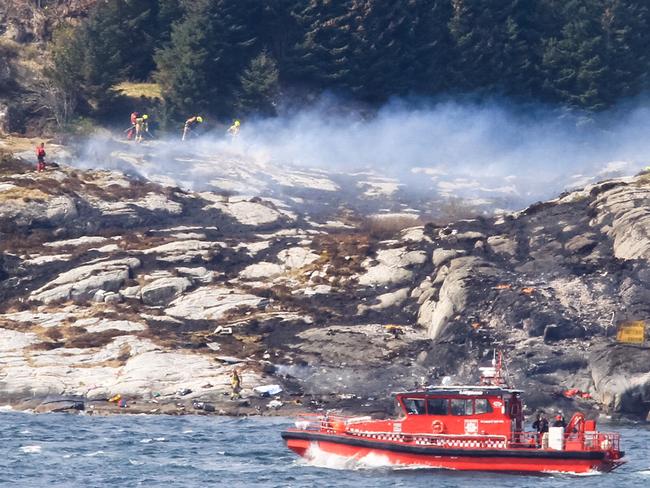 A search and rescue vessel patrols off the island of Turoey, near Bergen in Norway, as emergency workers attend the scene of a helicopter crash. Picture: Rune Nielsen/NTB scanpix via AP