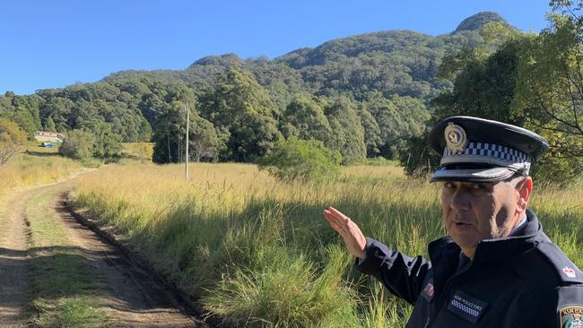 Chief Inspector Anthony Moodie at the scene on Tuesday morning, June 20. The home where the 78-year-old died is obscured behind the first ridgeline of trees and the brown shed where his 50-year-old son lives can be seen to the left. Picture: Janine Watson