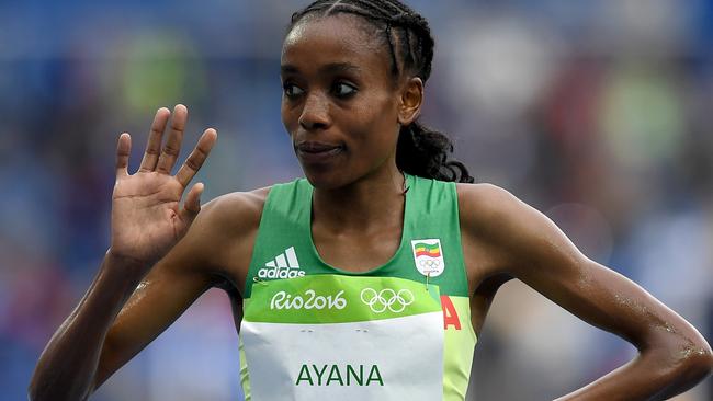 That’s how you set a world record. Ethiopian runner Almaz Ayana smashes the 10,000 metre final with a time of 29:17.45 on the opening day of athletics in Rio de Janeiro, Brazil. Picture: Shaun Botterill/Getty Images.