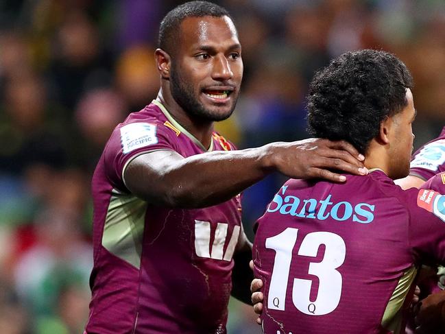 MELBOURNE, AUSTRALIA - APRIL 23: Suliasi Vunivalu of the Reds (L) celebrates with team mates during the round 10 Super Rugby Pacific match between the Hurricanes and the Queensland Reds at AAMI Park on April 23, 2022 in Melbourne, Australia. (Photo by Kelly Defina/Getty Images)