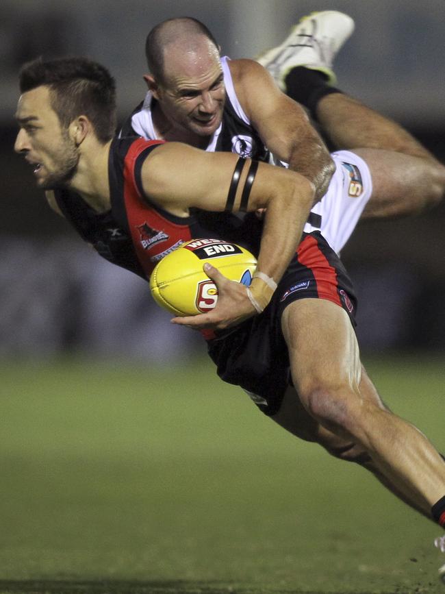 Port's Matthew Broadbent, tackling West’s Brett Turner, is on the verge of an AFL return. Picture Dean Martin