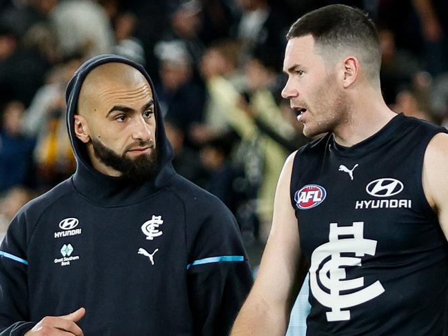 MELBOURNE, AUSTRALIA - APRIL 13: Adam Saad and Mitch McGovern of the Blues are seen during the 2024 AFL Round 05 match between the Carlton Blues and the Adelaide Crows at Marvel Stadium on April 13, 2024 in Melbourne, Australia. (Photo by Dylan Burns/AFL Photos via Getty Images)