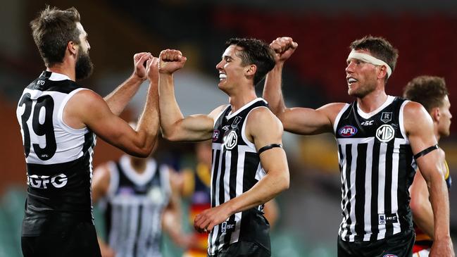 Celebrating a goal with Justin Westhoff and Connor Rozee. Picture: Daniel Kalisz (Getty).