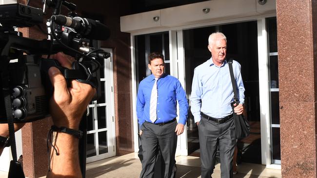 Ex-NT police commissioner John McRoberts leaves the Darwin Supreme Court with barrister Tony Elliott on Thursday following the guilty verdict issued against him