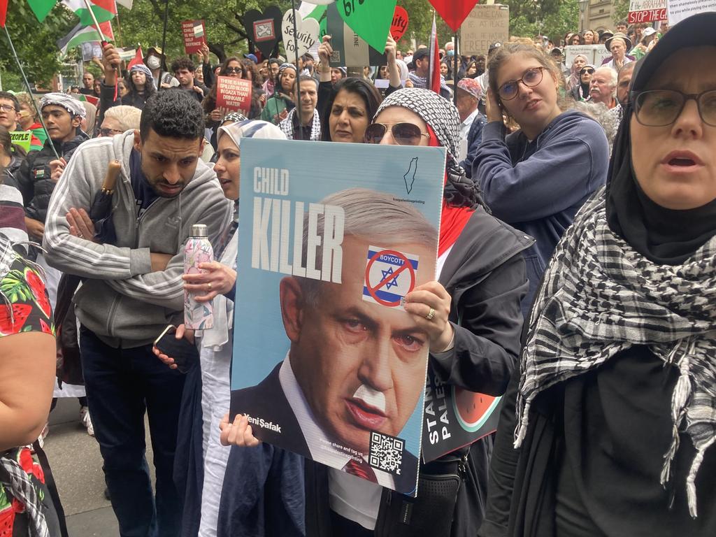 An offensive sign depicting Benjamin Netanyahu with a drawn-on Hitler moustache.