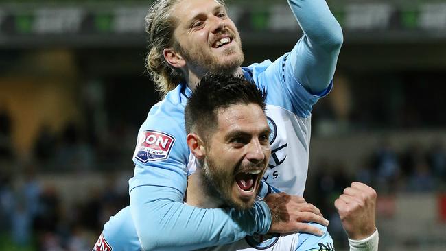 Bruno Fornaroli celebrates a goal with teammate Luke Brattan. Picture: George Salpigtidis