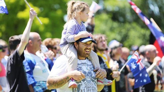 A child rides on the shoulders of an anti-Islam protester at the Reclaim Australia rally. Picture: Nathan Dyer