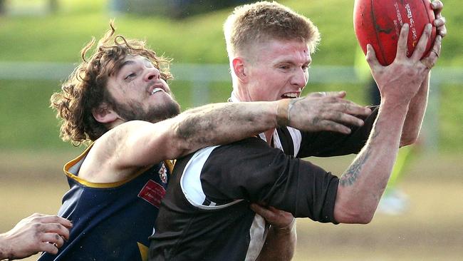 Craigieburn’s Brodie White is tackled by Campbell Wearne of Doutta Stars. Picture: Hamish Blair