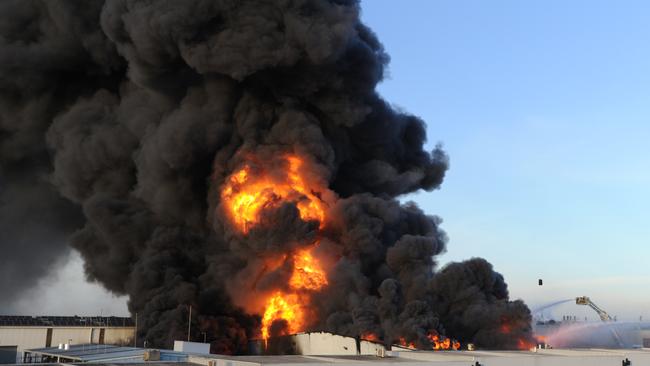 An out of control fire rages through factories around Thornycroft Street Campbellfield. Picture: Andrew Henshaw