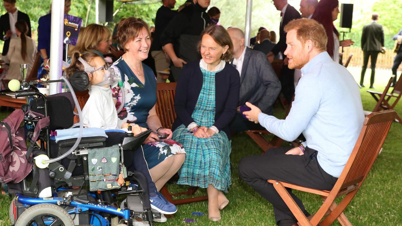 Harry speaks to Outstanding Professional Award winner Anna Marie McLachlan with the family she supports. Picture: Antony Thompson/TWM/WellChild/PA Wire