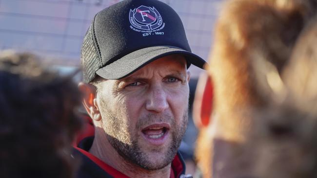 MPNFL football: Frankston Bombers v Frankston YCW. Frankston bombers coach addressing players. Picture: Valeriu Campan