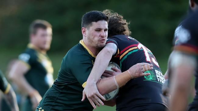 Wyong’s Luke Bartley taking a charge. Picture: Sue Graham