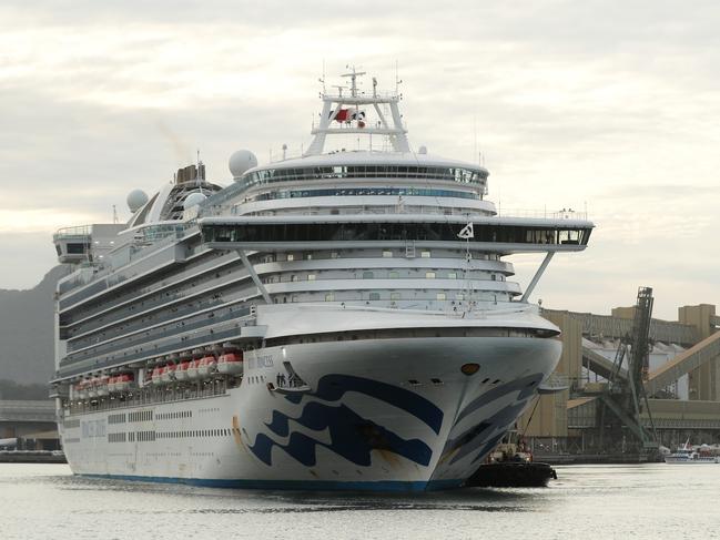 WOLLONGONG, AUSTRALIA - APRIL 23: The Ruby Princess cruise ship departs from Port Kembla on April 23, 2020 in Wollongong, Australia. Australian Border Force has ordered the Ruby Princess to depart Australian waters today, as two separate inquiries continue over how the ship's 2700 passengers were allowed to disembark in Sydney in March without adequate health checks during the coronavirus (COVID-19) pandemic. A special commission of inquiry has been established by the NSW government over the handling of the Ruby Princess' arrival into Sydney on 19 March, while NSW Police are also conducting a separate criminal investigation. There are now 21 deaths linked to the Ruby Princess along with more than 600 confirmed coronavirus (COVID-19) cases.  (Photo by Mark Metcalfe/Getty Images)