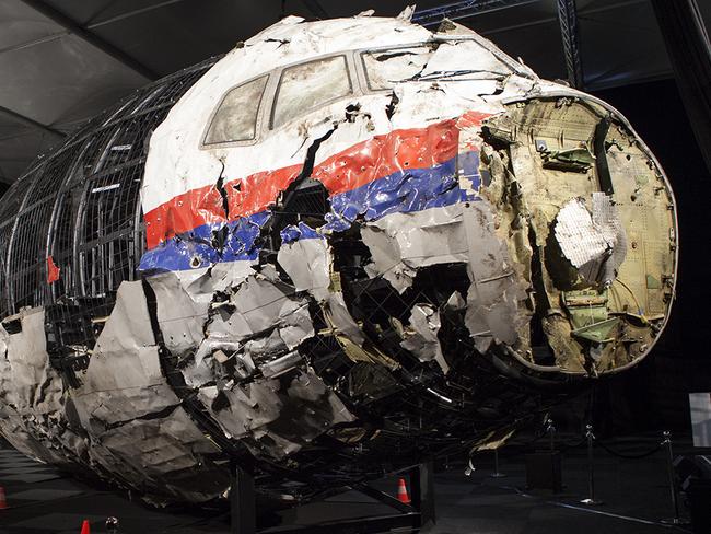 A supplied image obtained Wednesday, Oct. 14, 2015 of a reconstructed section of the Malaysia Airlines plane that was downed by a missile over Ukraine, killing 298 people at the Gilze-Rijen Air Force Base, the Netherlands on Wednesday. Parts of the cockpit and business class were reconstructed from wreckage retrieved from Ukraine and brought to the Netherlands where the crash investigation was based. (AAP Image/Dutch Safety Board) NO ARCHIVING, EDITORIAL USE ONLY