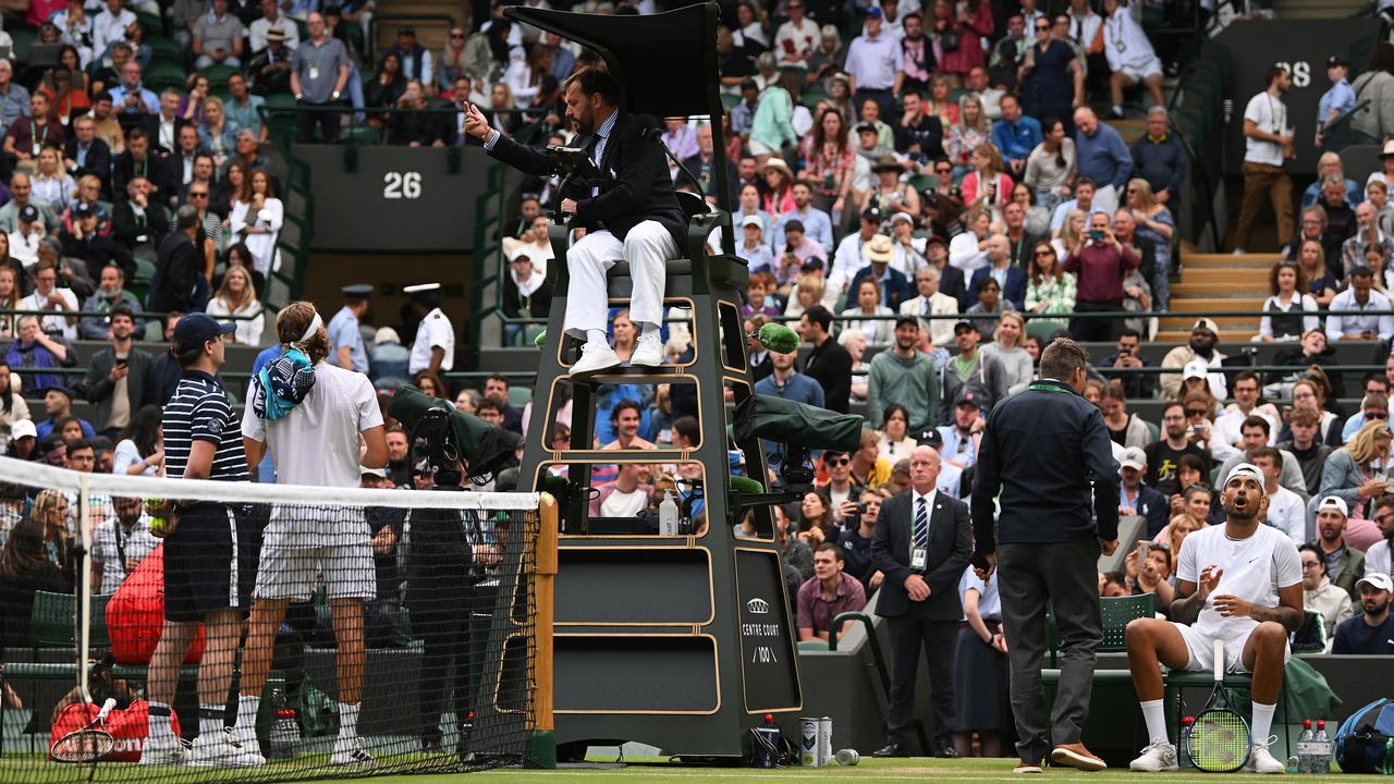 The match umpire speaks with both Stefanos Tsitsipas of Greece and Nick Kyrgios of Australia during their Men's Singles Third Round match. (Photo by Shaun Botterill/Getty Images)