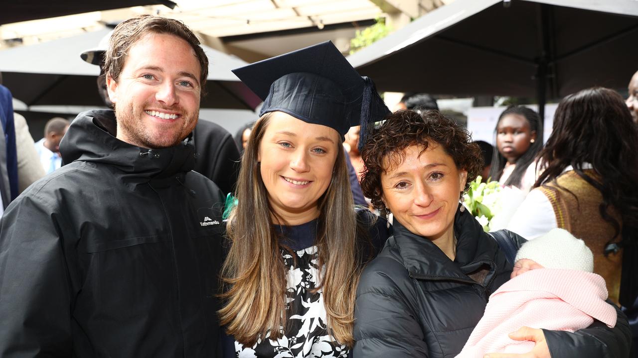 Deakin graduate Elizabeth Murdoch with husband Ayden and mum Maia Souvatzis holding four week old Zoe. Picture: Alison Wynd