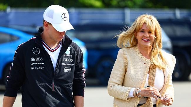 Mick Schumacher and Corinna Schumacher walk in the Paddock. Photo by Mark Thompson/Getty Images.