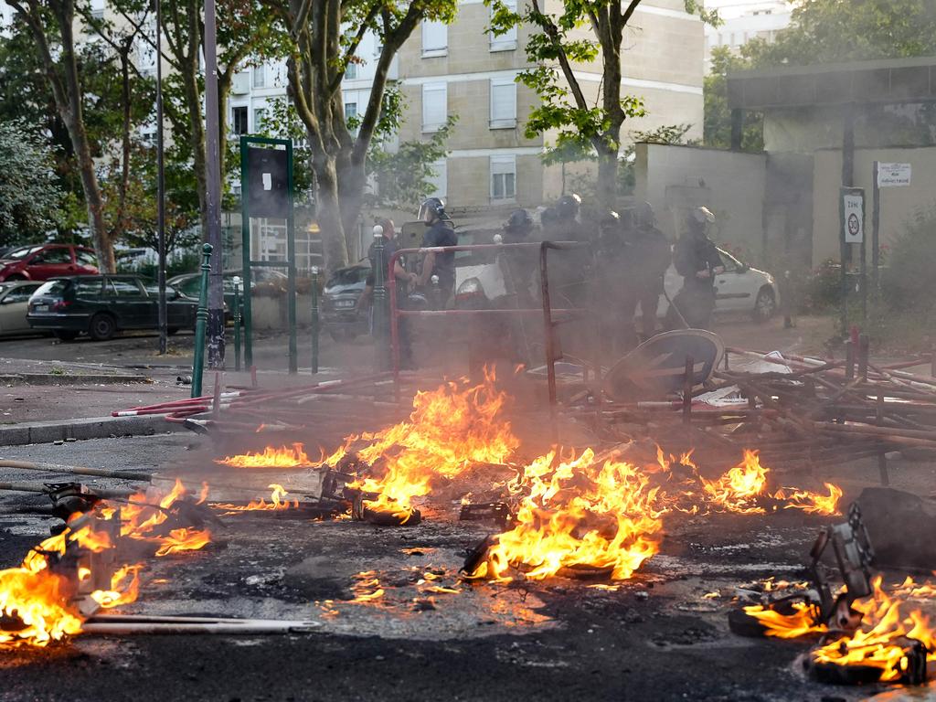 Fires were still burning on Friday morning. (Photo by Zakaria ABDELKAFI / AFP)