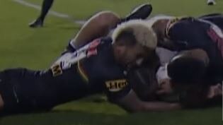 Viliame Kikau just gets his arm under the ball as Justin Olam attempts the try.