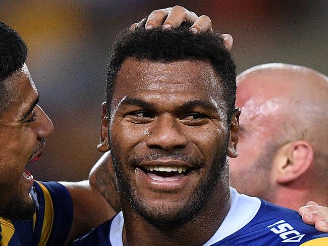 Maika Sivo of the Eels (centre) celebrates with teammates after scoring a try during the Round 3 NRL match between the Parramatta Eels and Sydney Roosters at ANZ Stadium, Sydney, Friday, March 29, 2019. (AAP Image/Dan Himbrechts) NO ARCHIVING, EDITORIAL USE ONLY