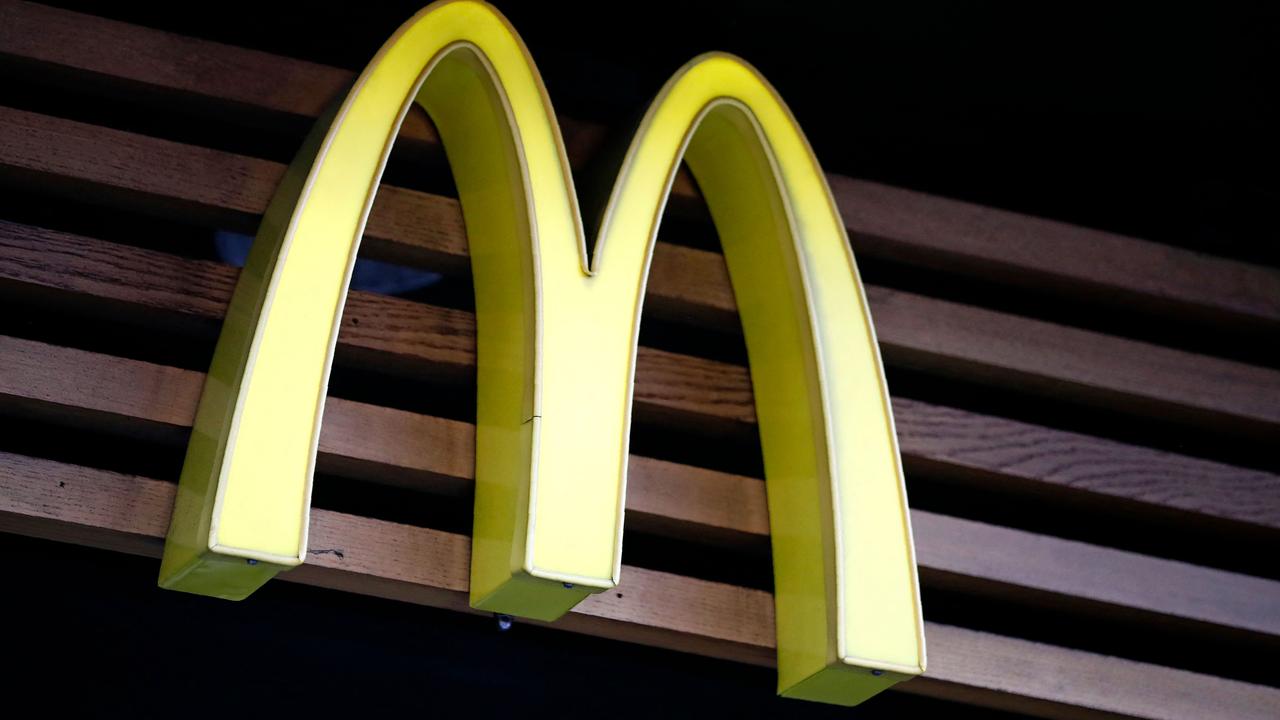 McDonald’s has laid off hundreds of workers. (Photo by Tolga AKMEN / AFP)