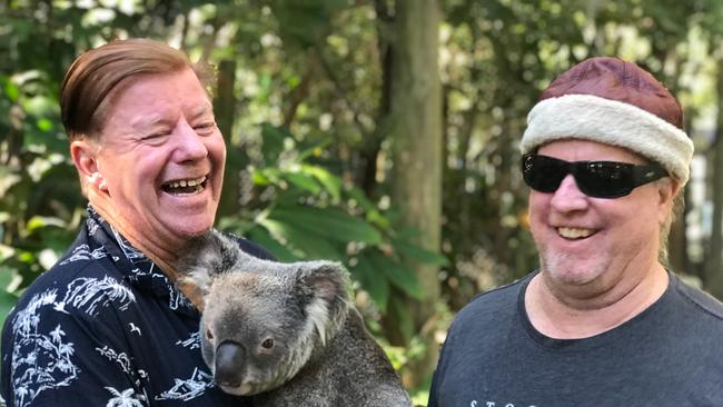 Wayne " Rabbit" Bartholomew (left) and Chairman of Gold Coast World Surfing Reserve Andrew McKinnon with Bunker the Koala from Currumbin Wildlife Sanctuary. Photo credit Larisa Cevallos/ Sweet Ocean