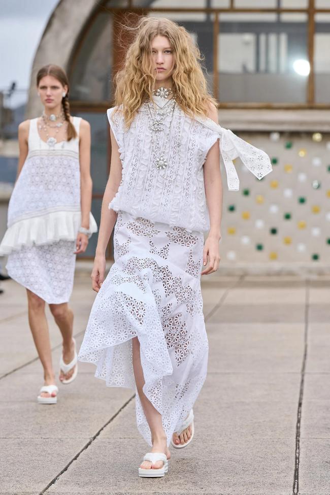 Chanel resort 2025. Image credit: GoRunway.comBohemian lace and patchworkIt only took Chloé’s bohemian autumn/winter ’24/’25 show to usher in a full-scale return of fashion’s boho-chic trend. But amid the excitement, it was overlooked how enduring, durable and timeless the beatnik aesthetic can be, particularly in its embrace of lace, a breezy material for spring. Lace and patchwork dresses are often made in billowing shapes, but clean-lined iterations came in Chanel (above) and Gucci’s resort collections; the former’s patchwork dresses apt for travelling from beach to bar, and the latter turning the material into form-fitting shorts for warm-weather days. 