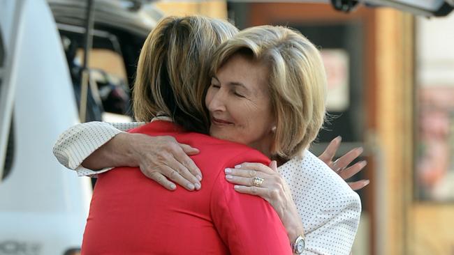 Selina Win Pe hugs Katrina Dawson's mother as she leaves the Lindt Cafe siege inquest in Sydney. Picture: Jeremy Piper