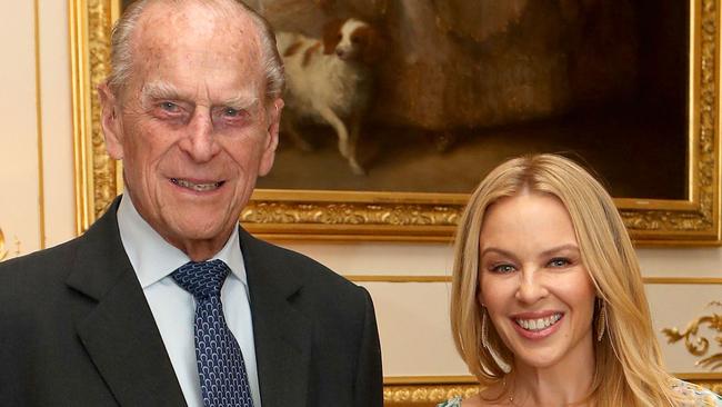 FILE- May 4:  Prince Philip, Duke of Edinburgh is to retire from public duties in the Autumn WINDSOR, UNITED KINGDOM - APRIL 04: Prince Philip, Duke of Edinburgh, Patron of the Britain-Australia Society, presents Kylie Minogue with the Britain-Australia Society Award for 2016 during a private audience in the White Drawing Room at Windsor Castle on April 4, 2017 in Windsor, United Kingdom.. The Britain-Australia Award recognises Australian and British individuals who have made a significant contribution to the Australia-UK bilateral relationship. Past recipients include Barry Humphries, and the Rt Hon Lord Hague PC.  (Photo by Steve Parsons - WPA Pool/Getty Images)