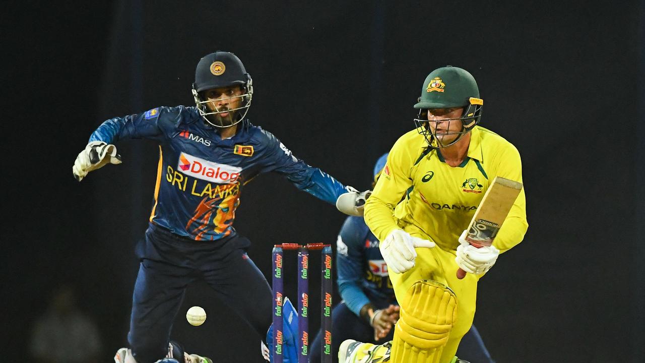 Australia's Alex Carey (R) plays a shot during the final one-day international (ODI) cricket match between Sri Lanka and Australia the R. Premadasa International Cricket Stadium in Colombo on June 24, 2022. (Photo by ISHARA S. KODIKARA / AFP)